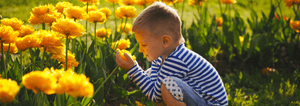Boy holding flower