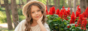 girl with red salvia flowers